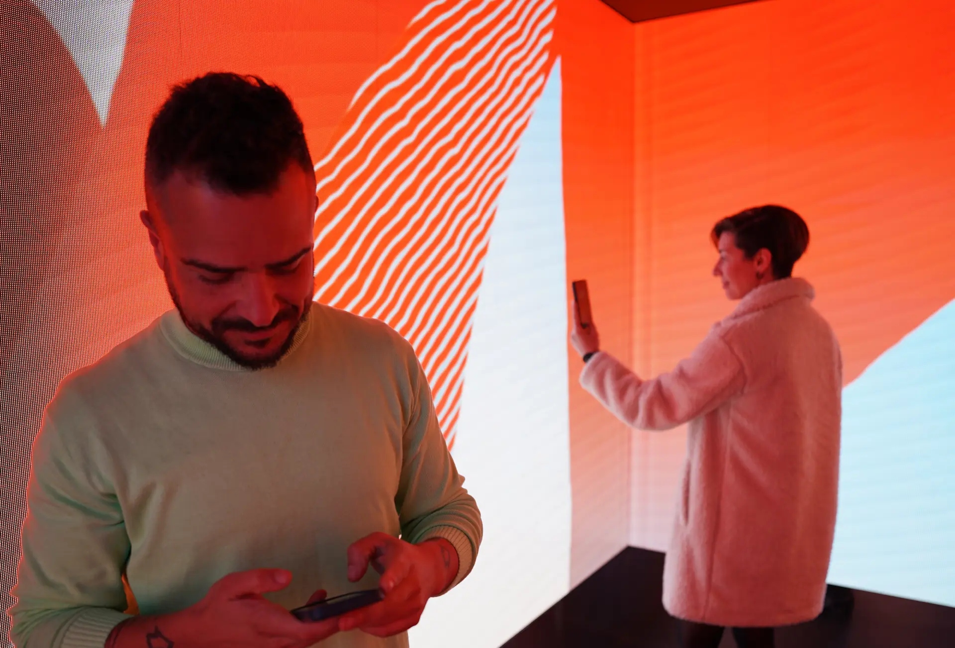 Visitors photographing the Bombay Sapphire immersive projection room at Vivid Sydney